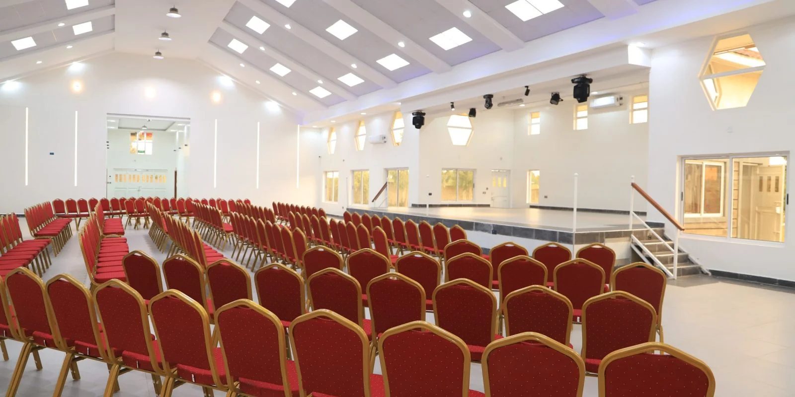 Conference hall set theatre-style with a stage